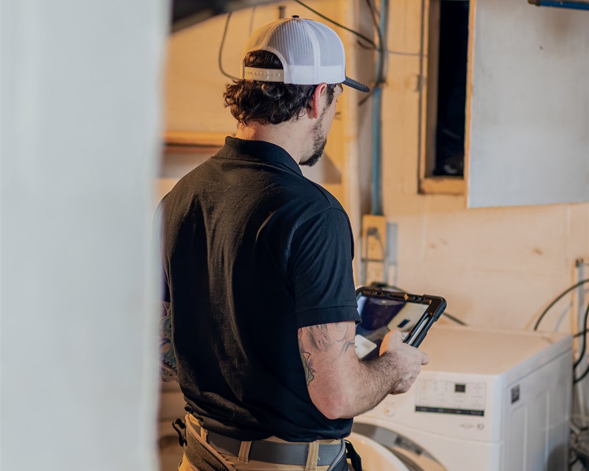 Frame inspector documenting HVAC and mechanical room conditions