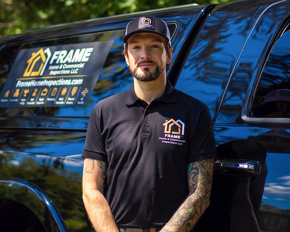 Frame Home & Commercial Inspections lead inspector beside the company truck
